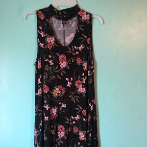 Floral dress with a cut out in the front.